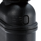 Close-up of a black mobile charger with control buttons on a white background