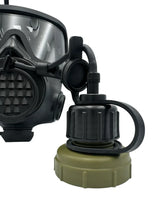 Close-up of a mira gas mask with a green tacvalve bottle cap with drinking hoses connecting it on a white background
