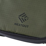 Green fabric material with Nestout logo on a white background